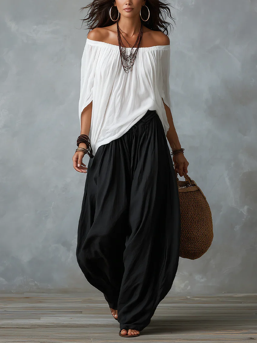 Conjunto Équilibre | Conjunto de top blanco con hombros descubiertos y pantalones holgados tipo farol.