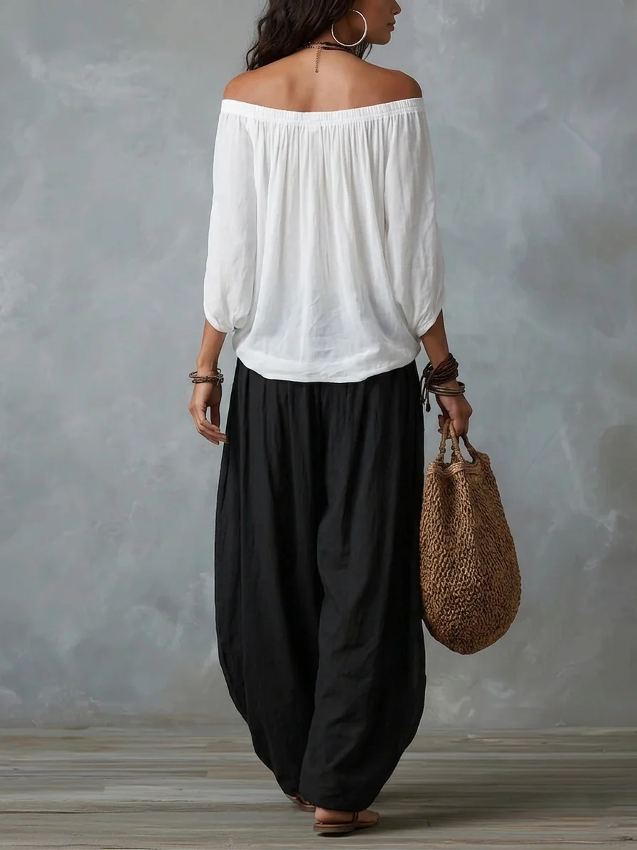 Conjunto Équilibre | Conjunto de top blanco con hombros descubiertos y pantalones holgados tipo farol.
