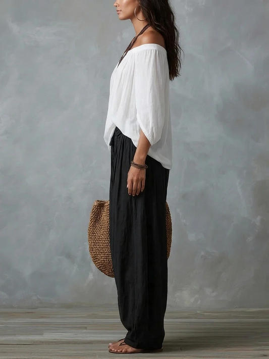 Conjunto Équilibre | Conjunto de top blanco con hombros descubiertos y pantalones holgados tipo farol.